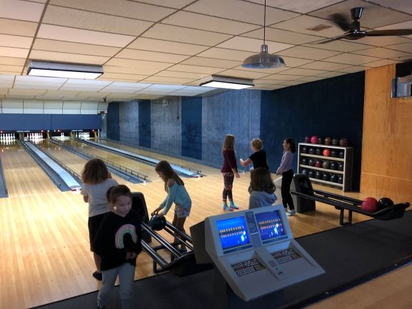 Students bowling during after school adventure club.